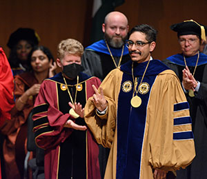 Image of two people at graduation