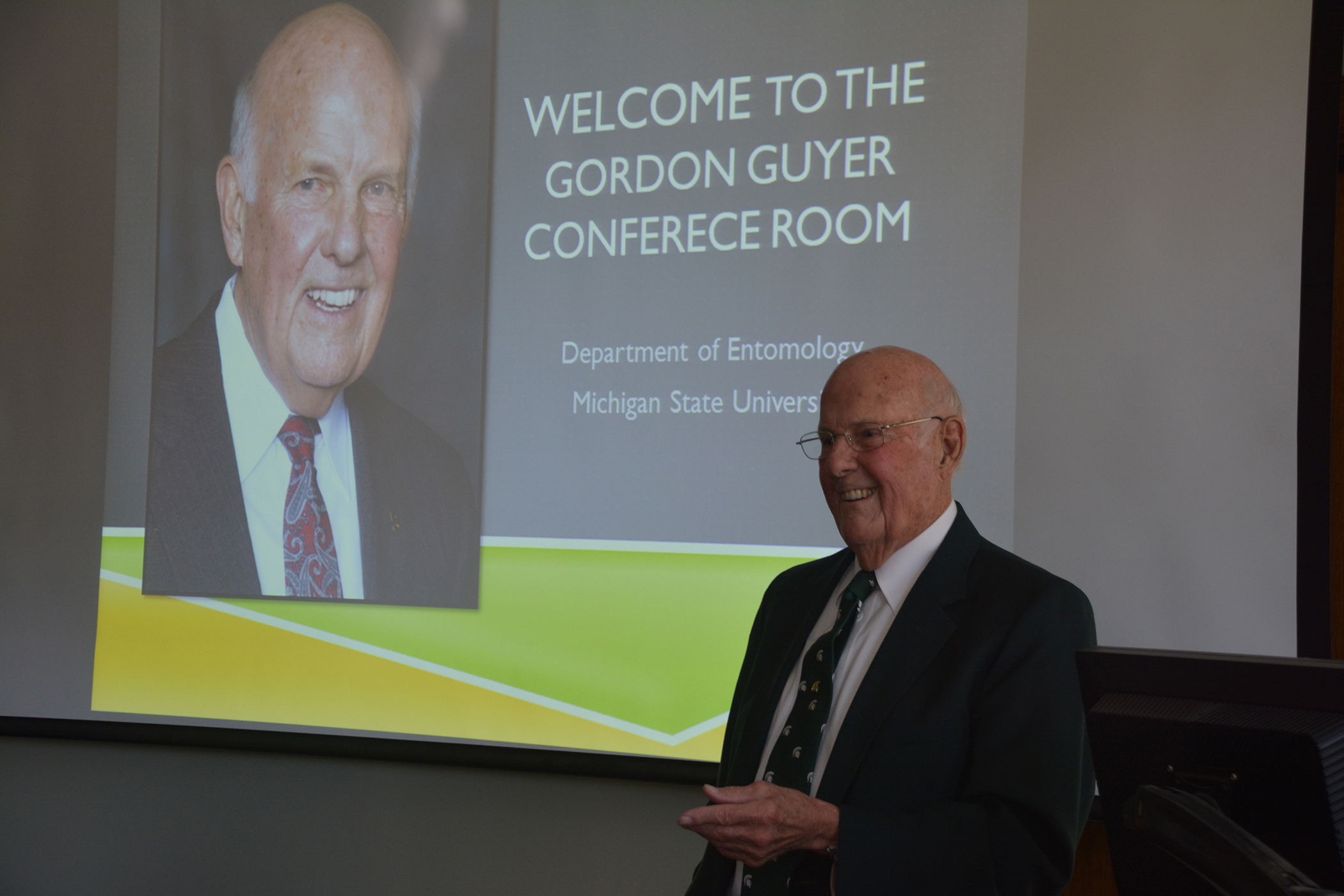 Guyer addresses the audience at the dedication of a conference room named in his honor at the MSU Department of Entomology on Nov. 2, 2014.